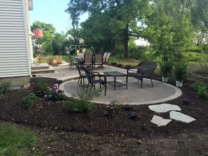 Finished round patio and stepping stones in the yard